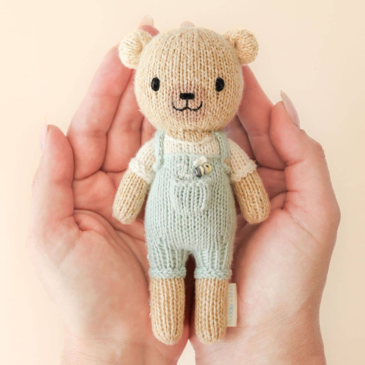Cuddle + Kind Hand-Knit Doll - Tiny Charlie the Honey Bear - Image 2
