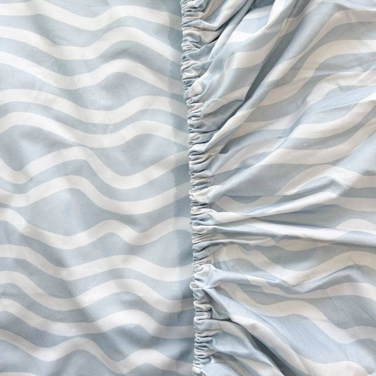 Little Human Linens Waterproof Cot Sheet - Bright Waves - Image 6